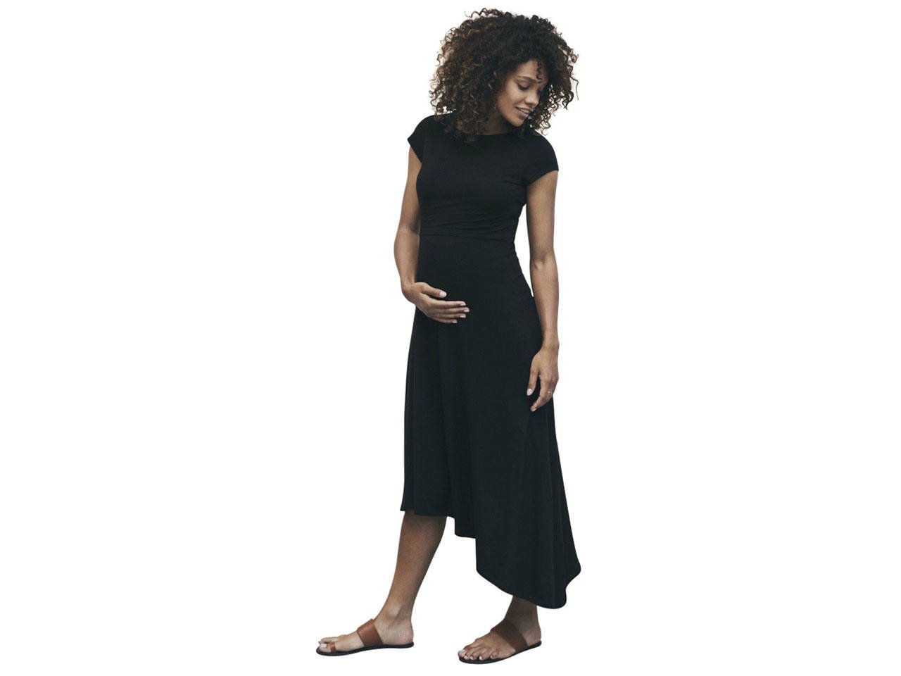 A pregnant woman wearing a black maternity dress