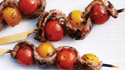 Three skewers with bbq'd tomatoes and steak