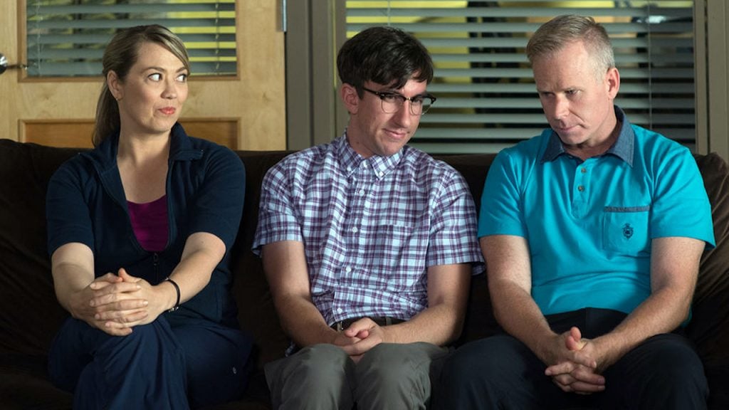 Promo image for Mr. D shoing three adults sitting awkwardly on a couch