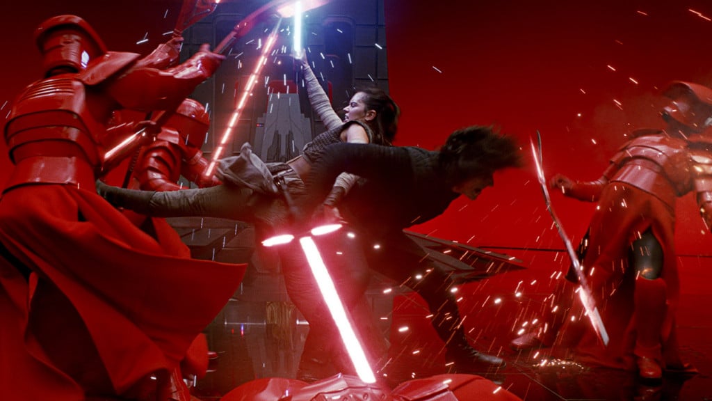 Promo image for Star Wars The Last Jedi showing Rey and Kylo Ren fighting guards with light sabers