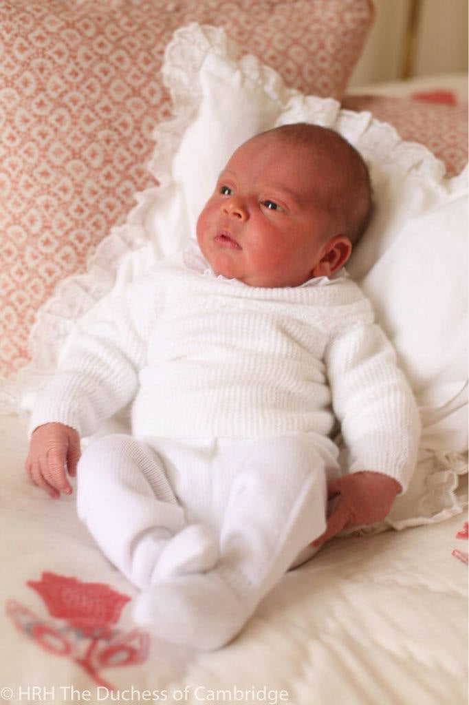 Prince Louis lying on a pillow