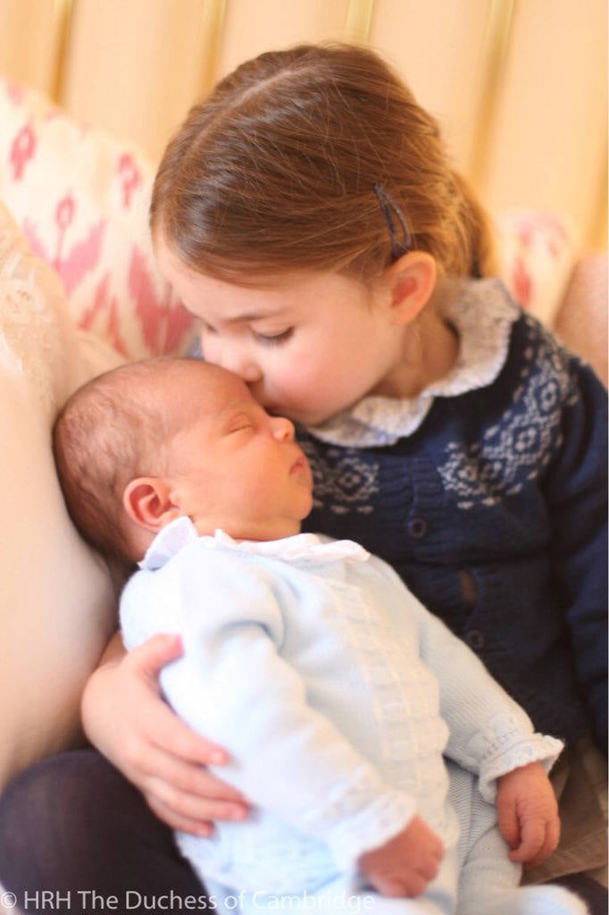 Princess Charlotte kisses Prince Louis on the head