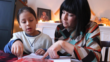 Marthe Troian and her son studying Ojibwa