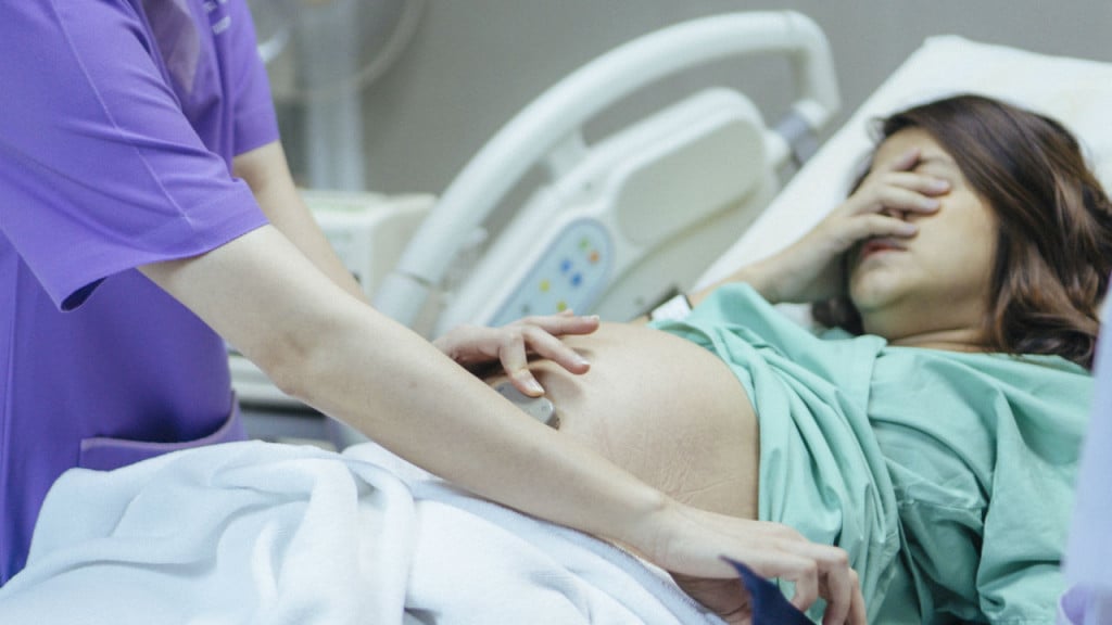 Woman giving birth in hospital