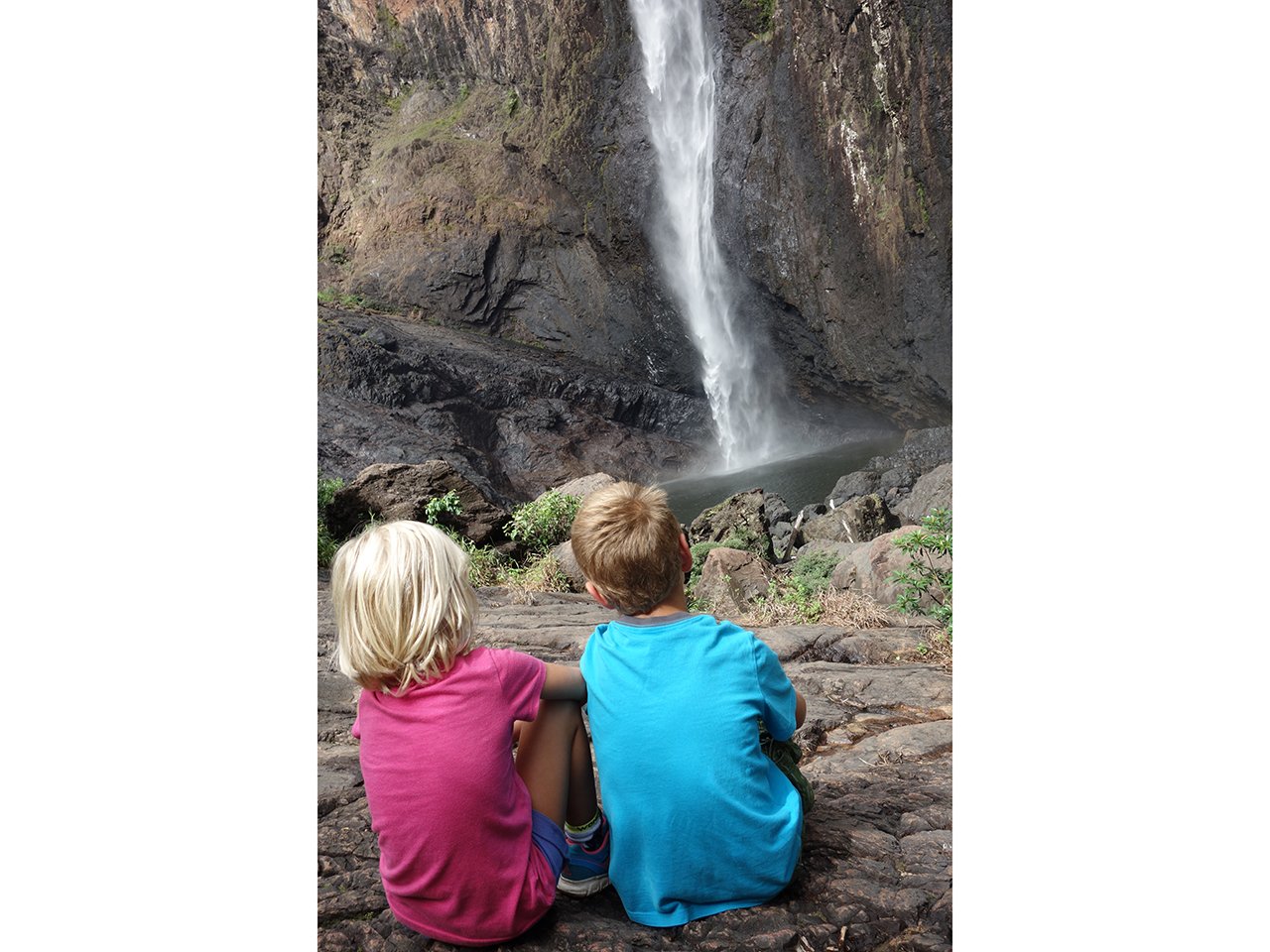 Salomon kids enjoying a waterfall