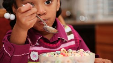 Little girl eating cereal