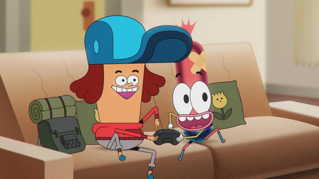 a kid and an animated hot dog boy play video games on the couch