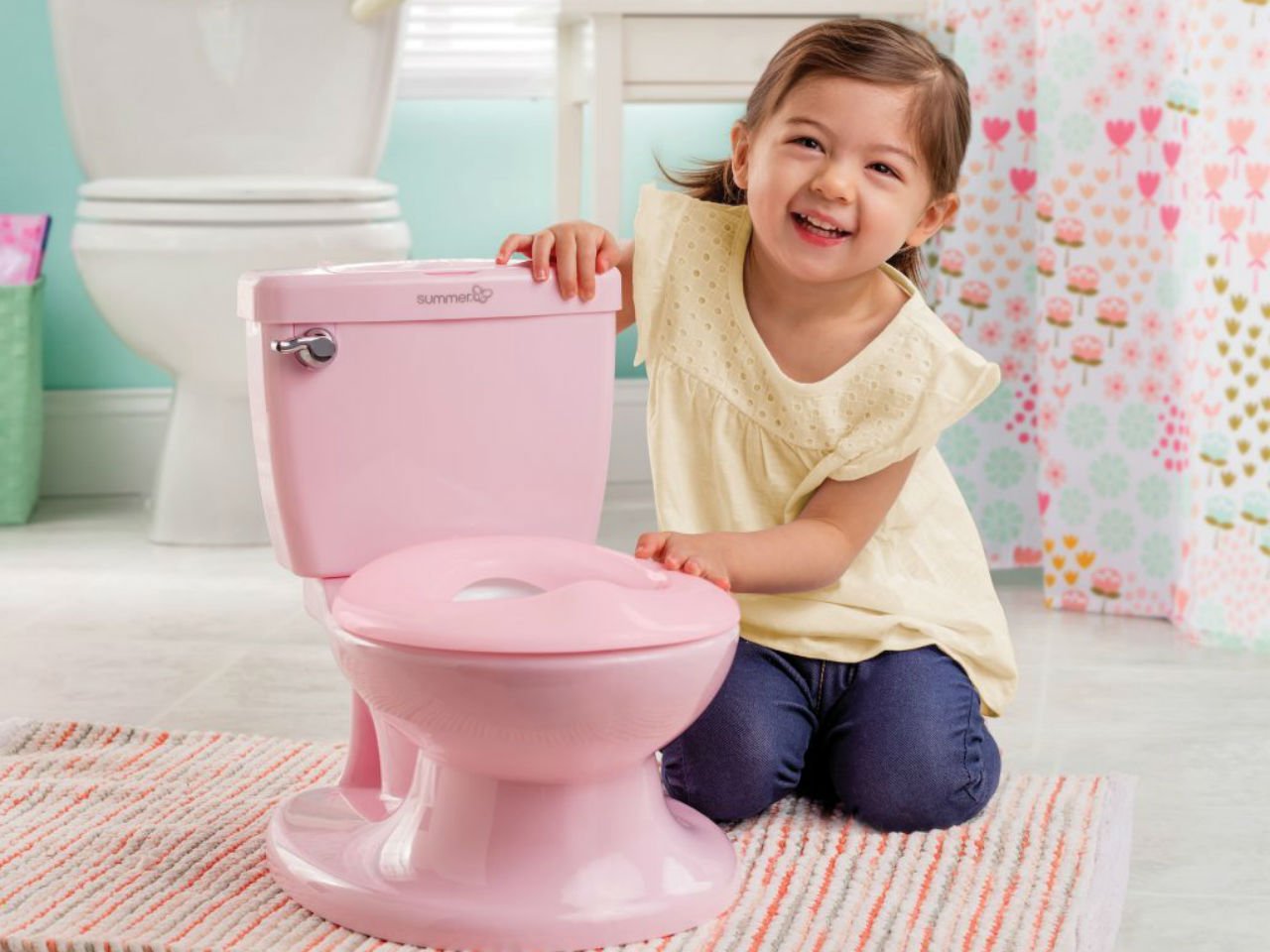 little girl with pink potty
