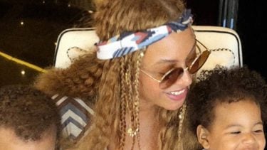 close up of beyonce with her twins Rumi and Sir
