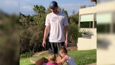 Gordon Hayward opening a gender reveal box with his two daughters