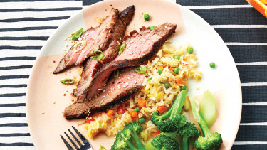 dinner plate with Korean steak, fried rice and broccoli