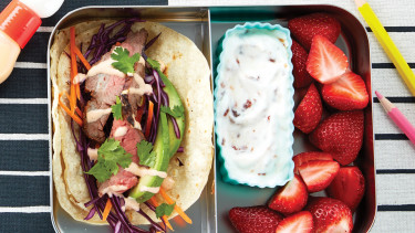 lunch box with taco and yogurt