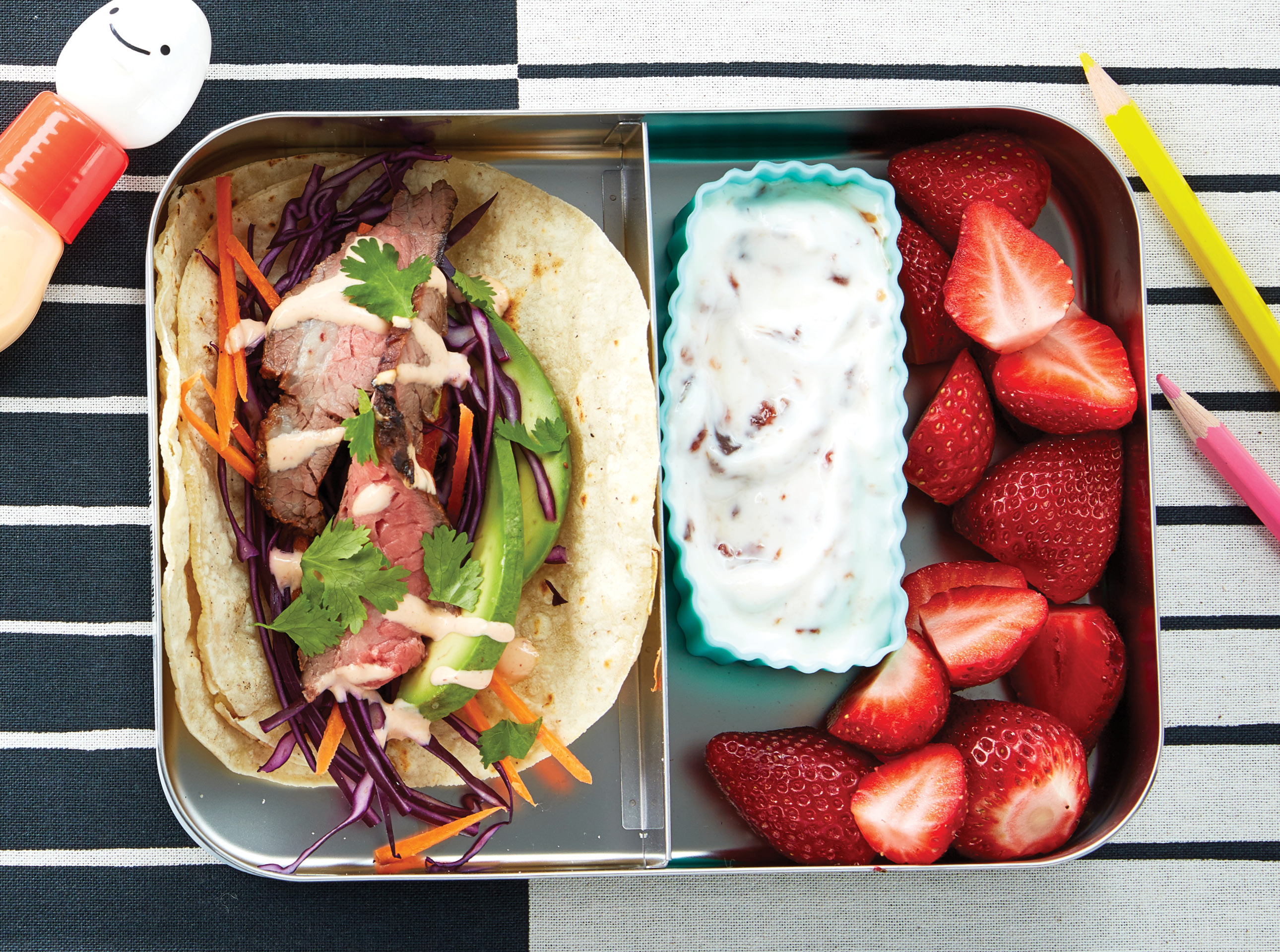 lunch box with taco and yogurt