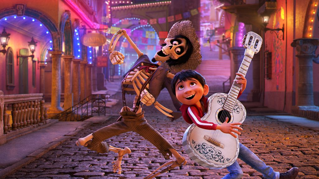 child playing a guitar and singing with a skeleton from the movie Coco