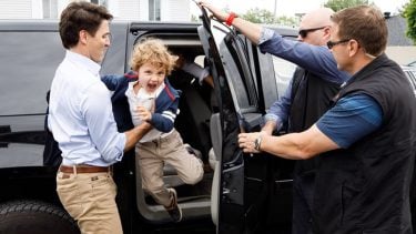 Hadrien Trudeau jumping out of a car into Justin's arms
