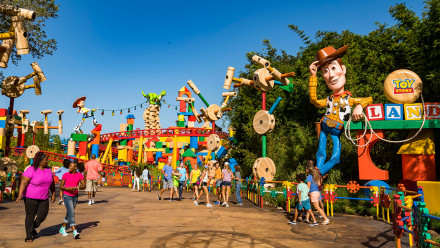Guests walking around the entrance of Toy Story Land