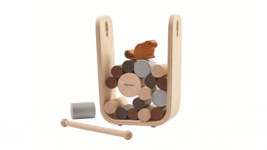 Plan Toys Timber Tumble Game: A Beaver balances on wood cylinders inside a U-shaped frame