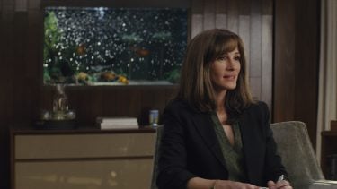 Julia roberts sitting in an office in a promo image for Homecoming
