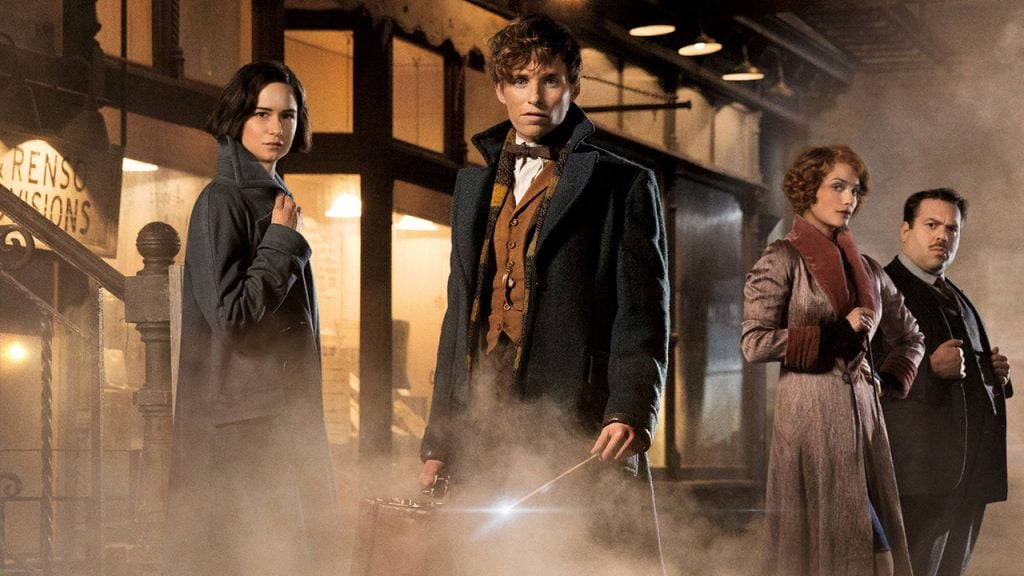 Promo image for Fantastic Beasts and Where to Find Them showing a group of people standing in a foggy street