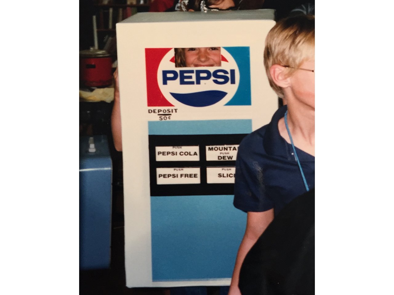 Young girl dressed as Pepsi vending machine