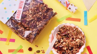 Bag and bowl filled with granola mix