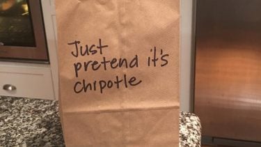Paper lunch bag with a note saying Just pretend it's Chipotle