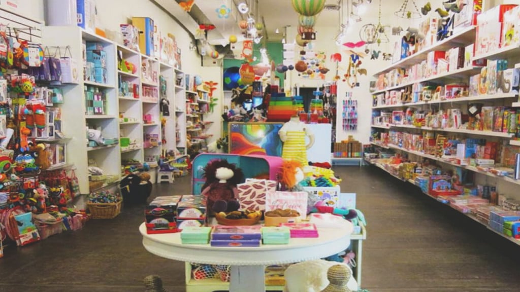 tables and shelves covered in colourful toys
