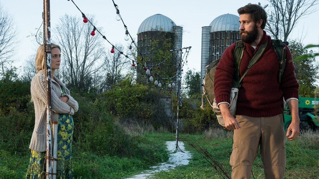 Promo image for a quiet place showing a couple talking to each other in a field