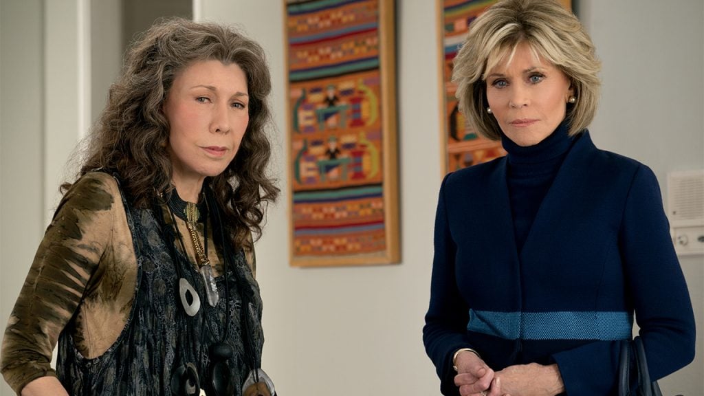 Promo image for Grace and Frankie showing two woman looking concerned