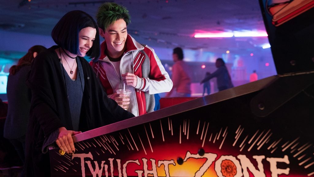 Promo image for Titans showing a young couple playing an arcade game at a bowling alley