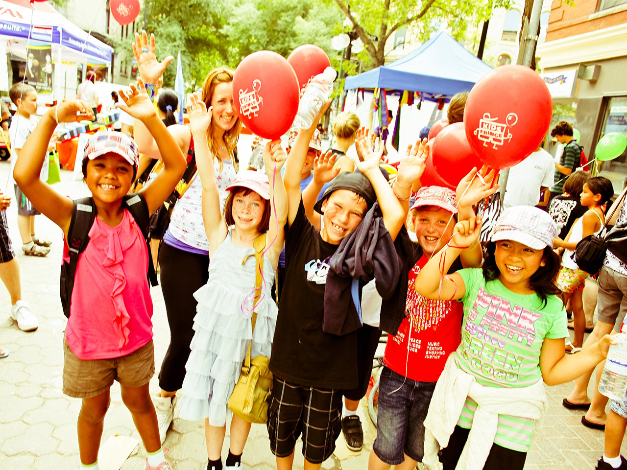 cheering kids with balloons at Winnipeg Fringe
