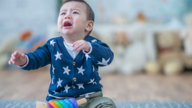 crying toddler on floor