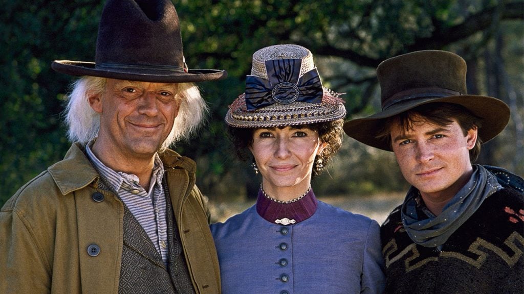 Promo image for Back to the Future Part 3 showing characters in western outfits
