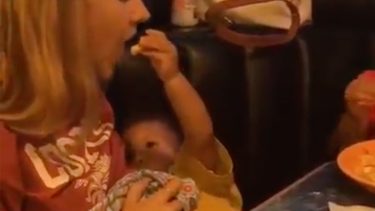 Baby feeding mom while breastfeeding