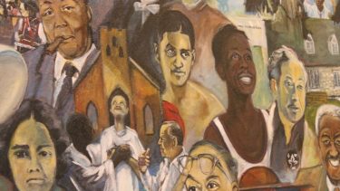 Close up of part of a painting that has historic black figures on it.