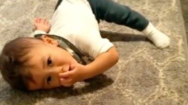 Miles looking adorable while trying to crawl