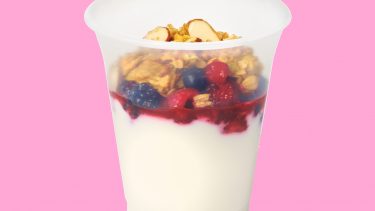 a tim hortons yogurt parfait on a pink background