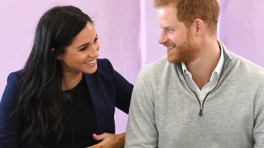 meghan and prince harry smiling at each other