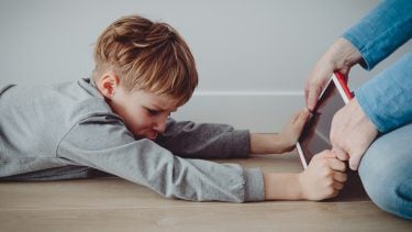 Little boy has tantrum as his parent takes away his iPad