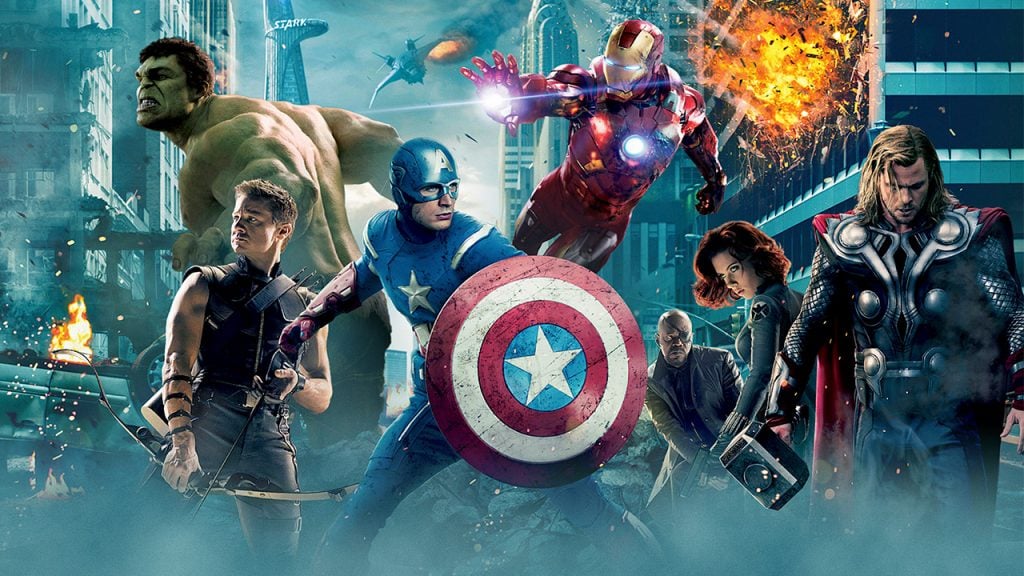 Promo image for The Avengers showing a team of superheroes fighting in a city