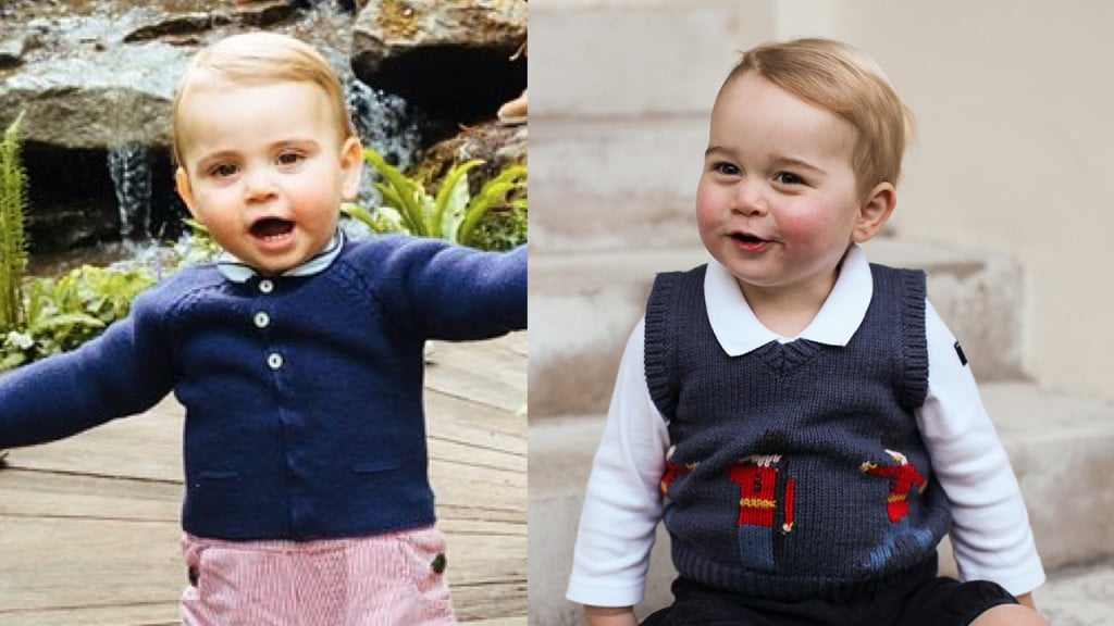 prince louis in a blue cardigan and red shorts beside young prince george in a white shirt and blue sweater vest