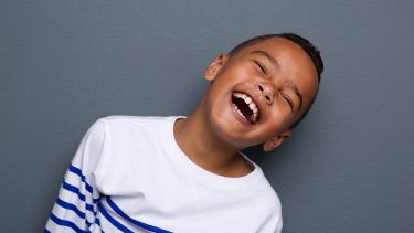 little boy laughing