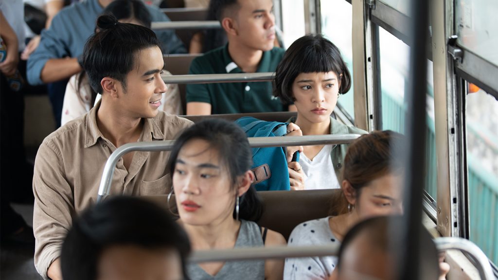 Promo image for Bangkok Love Stories: Objects of Affection showing a couple sitting on a public bus