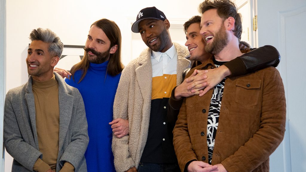 Promo image for Queer Eye showing five men standing in a room