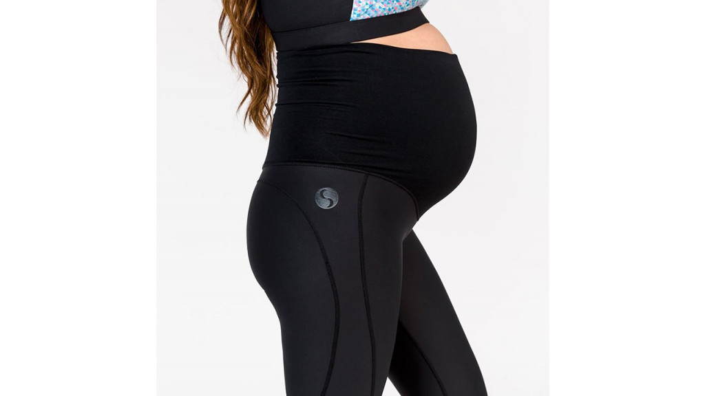 Woman wearing black maternity leggings
