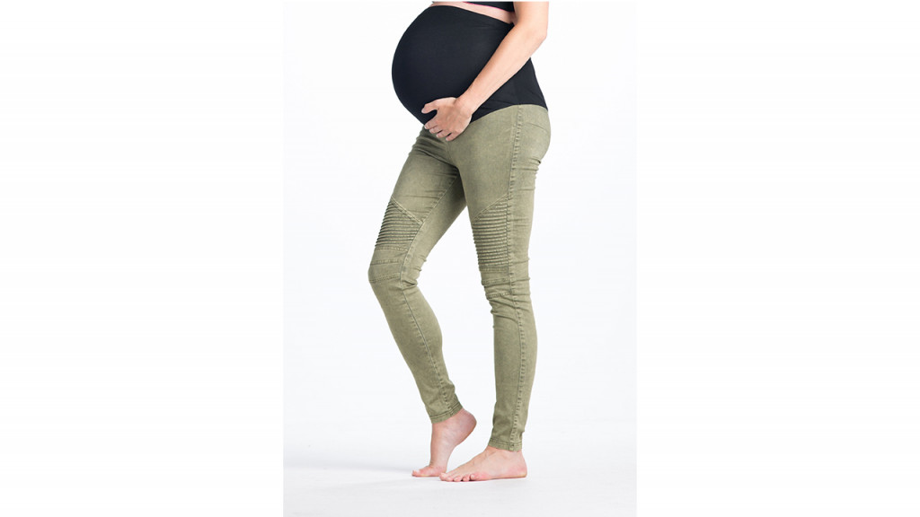 Woman wearing green maternity leggings