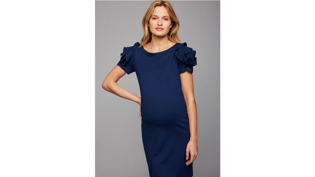 Woman wearing formal blue maternity dress