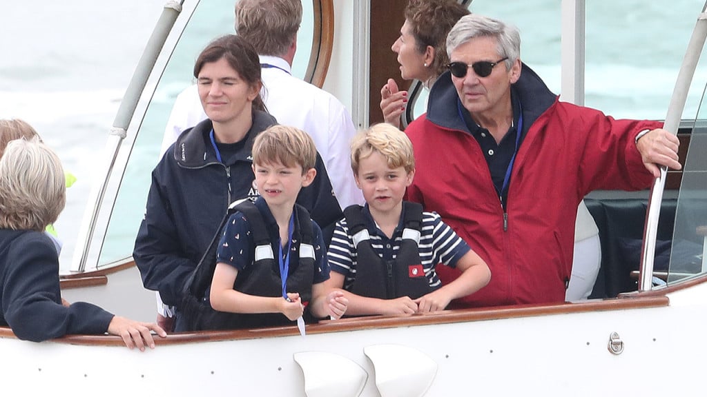 Prince George and a friend on a boat in life jackets