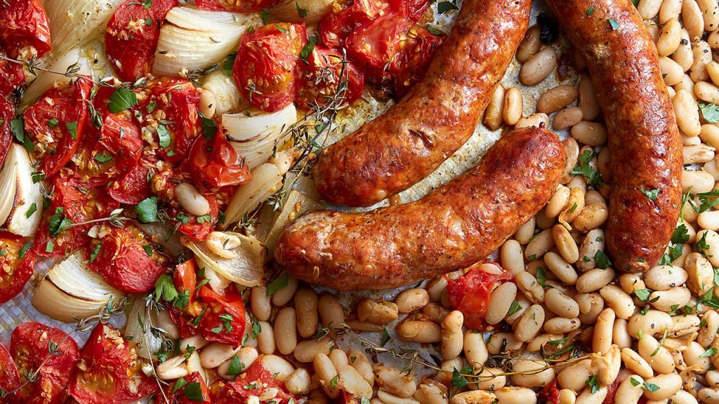 tray of sausage with tomatoes and beans