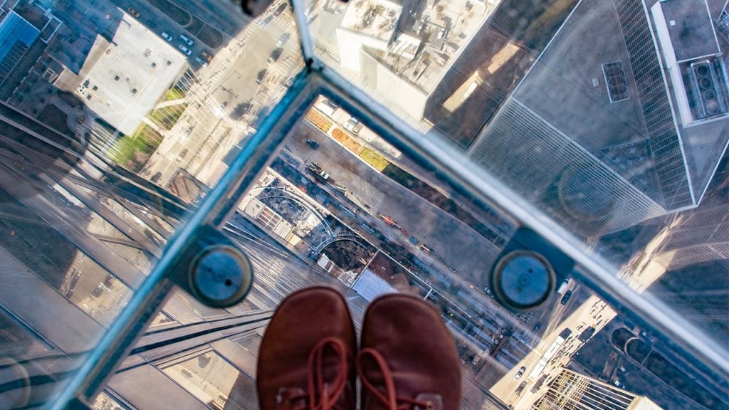 Downward view of Chicago from the clear glass Ledge at the WIllis Tower Skydeck